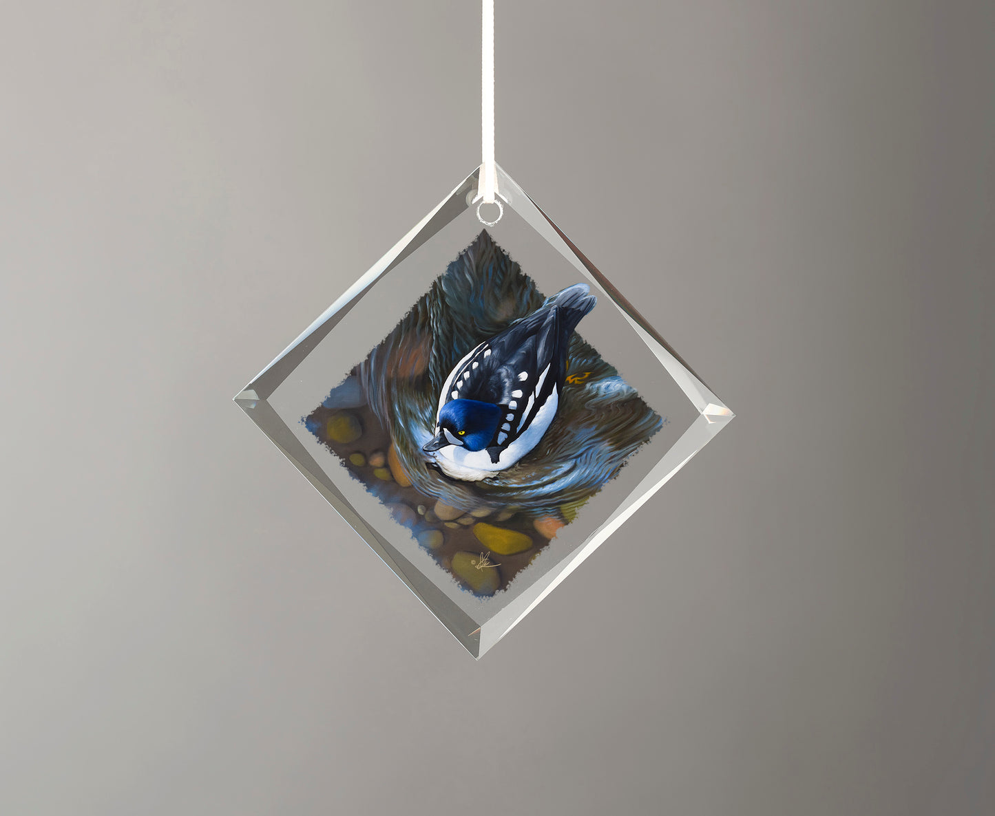 Glass ornament with a duck in the river painting