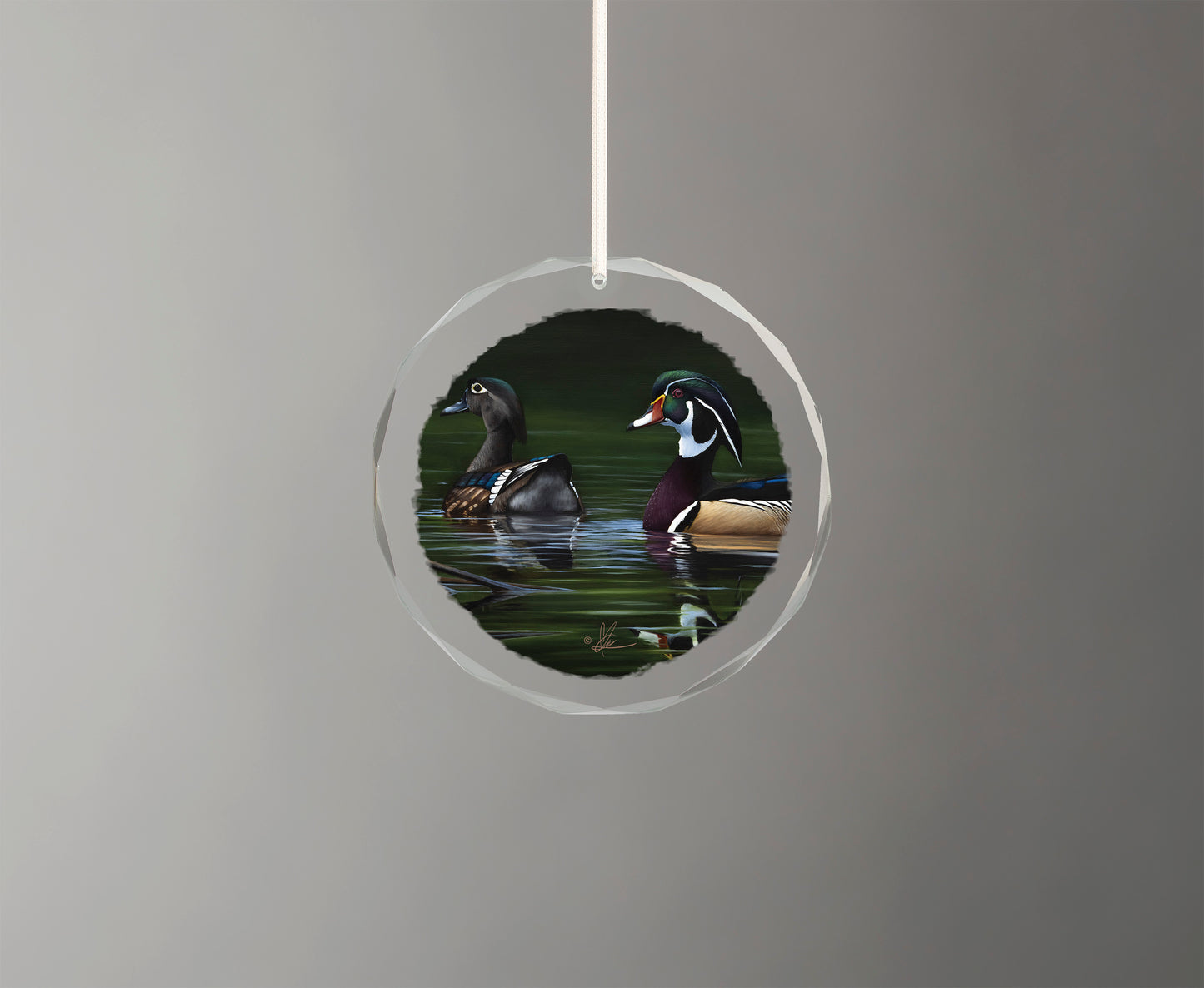 Glass ornament with birds in the river