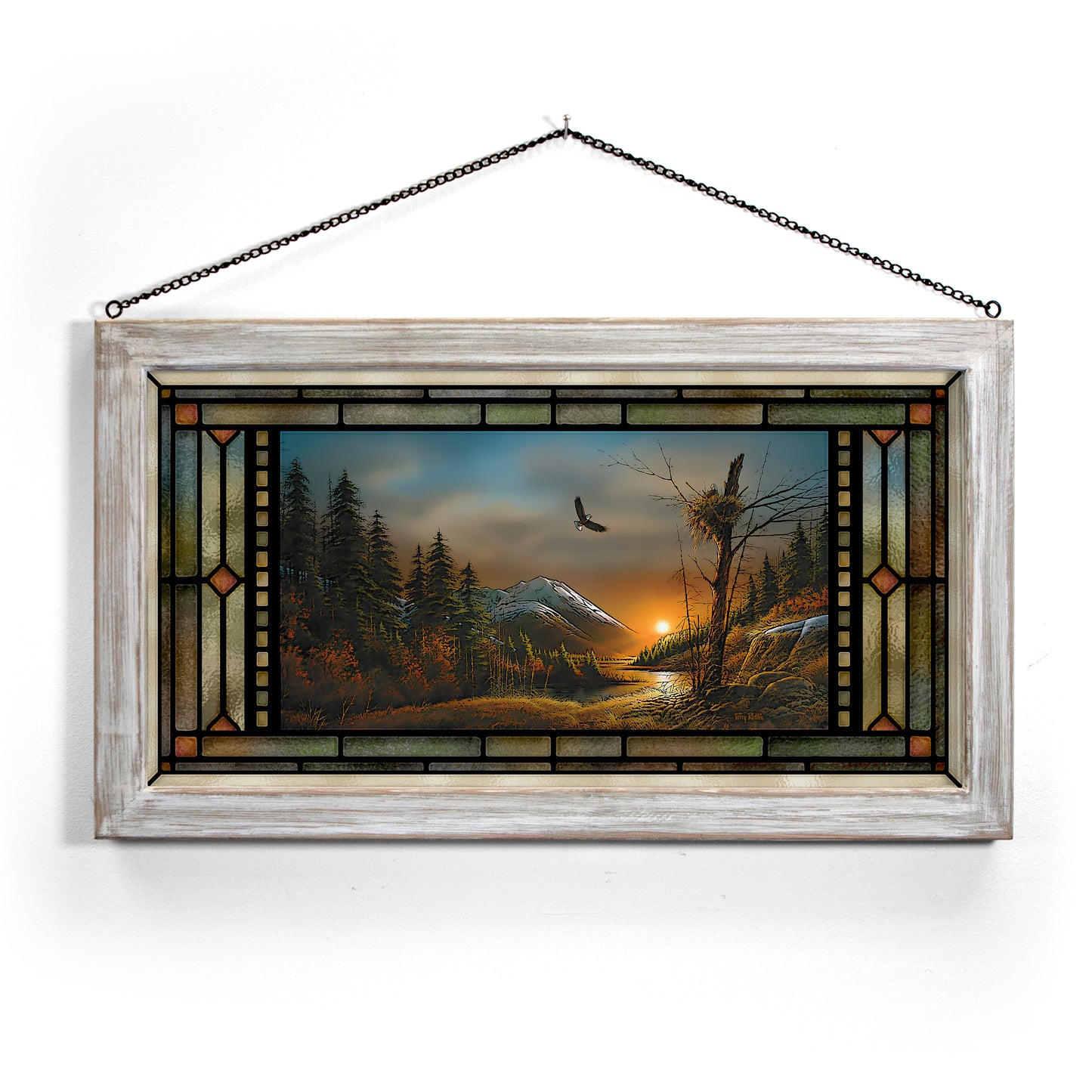 Framed painting of a flying bird over a landscape 