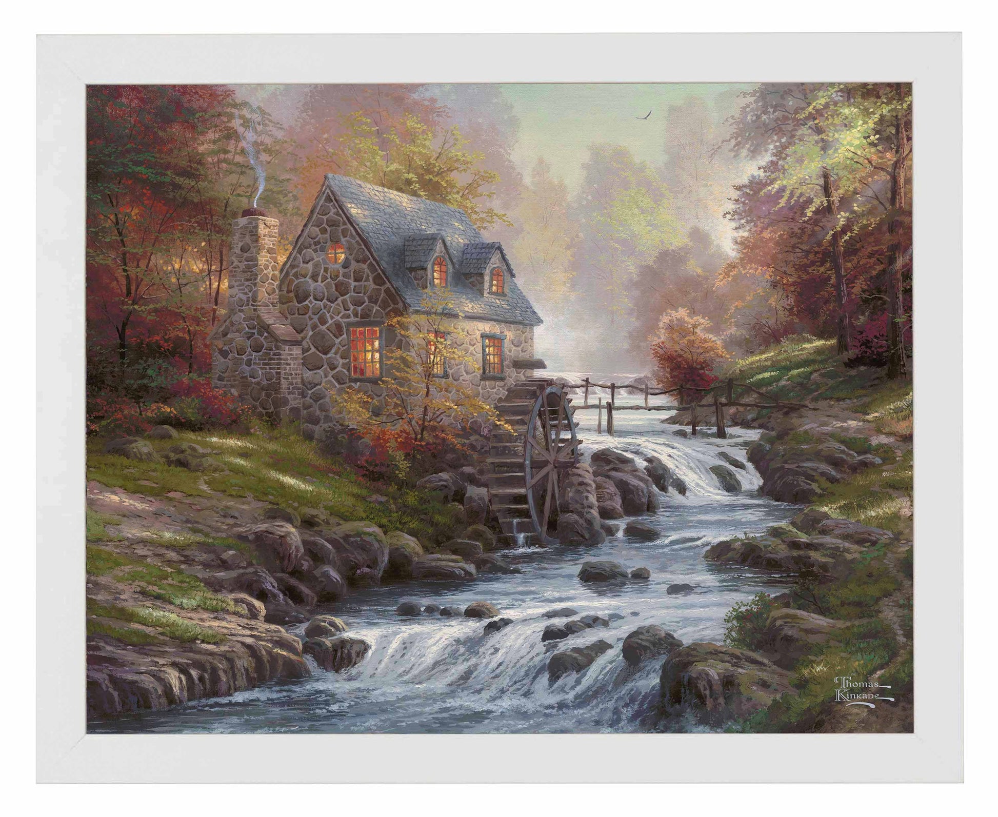 Framed painting of cobblestone house and trees by the river