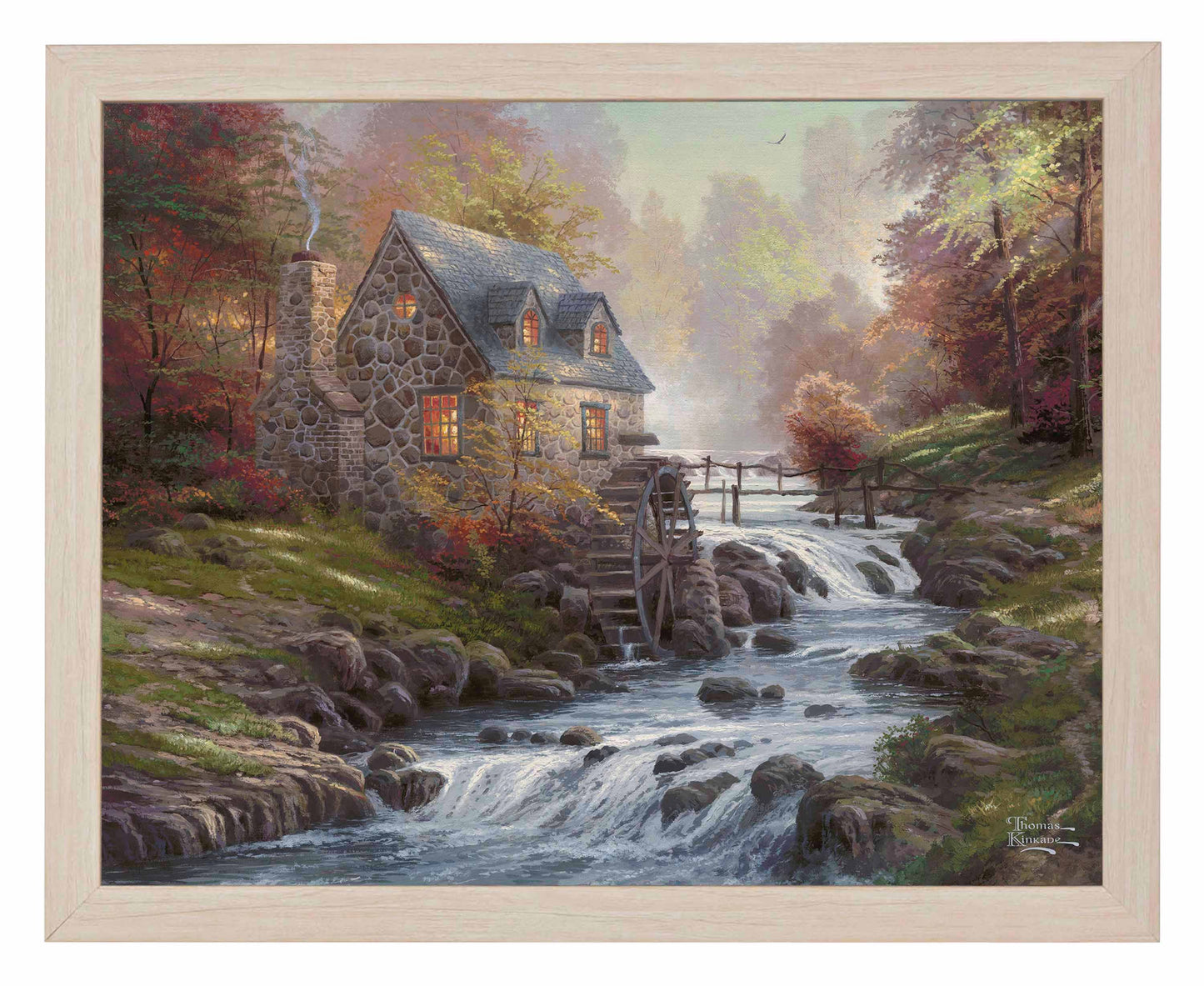 Framed painting of cobblestone house and trees by the river