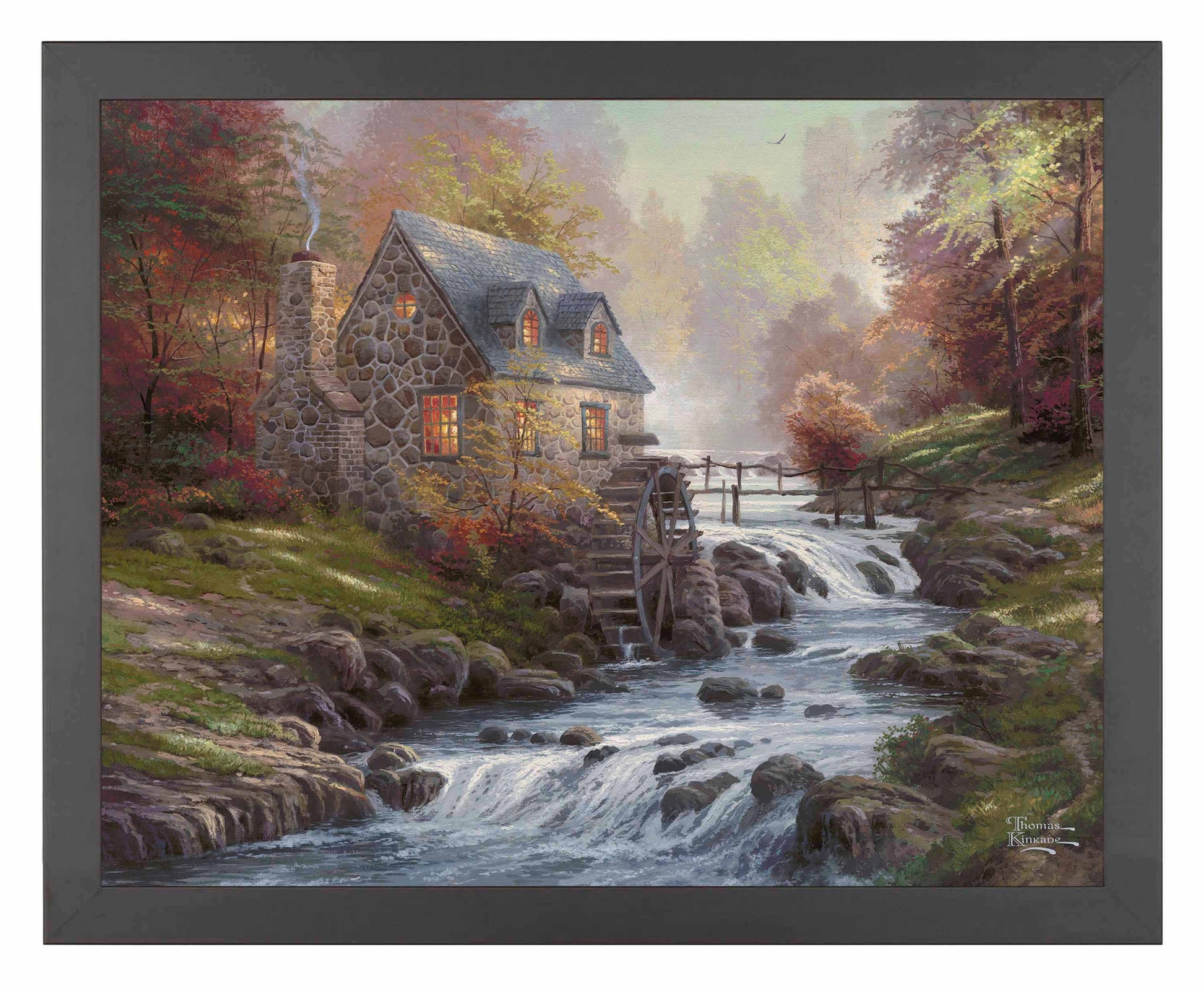 Framed painting of cobblestone house and trees by the river