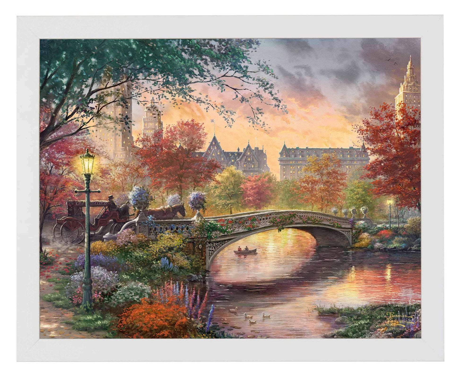 Framed painting of autumn in New York showing a bridge and trees by the river
