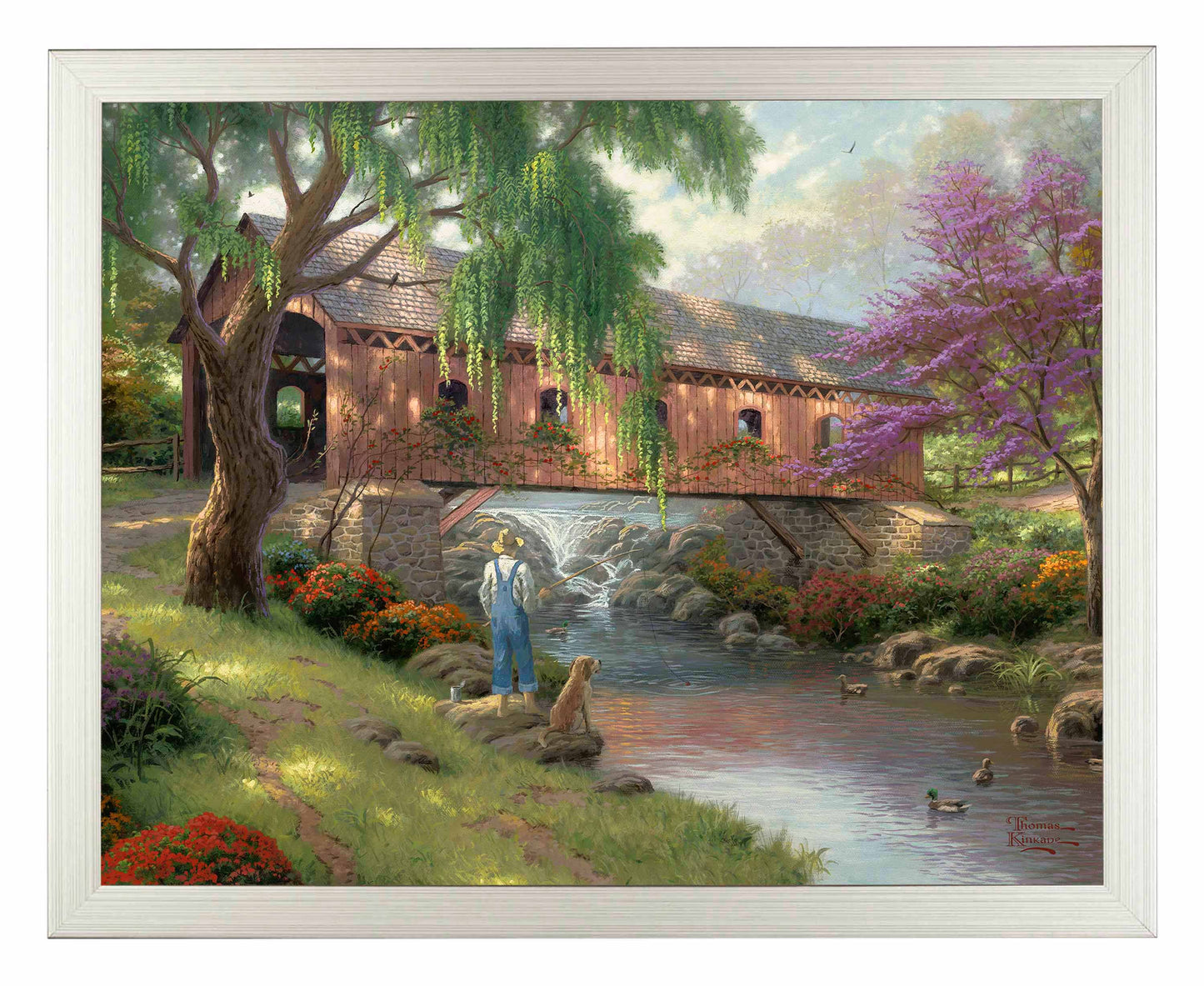 Framed painting of a house and trees by the river