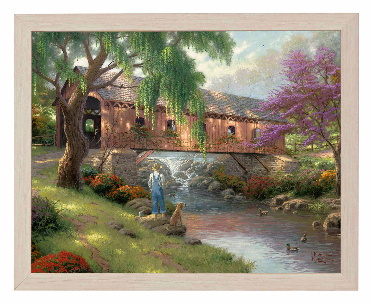 Framed painting of a house and trees by the river