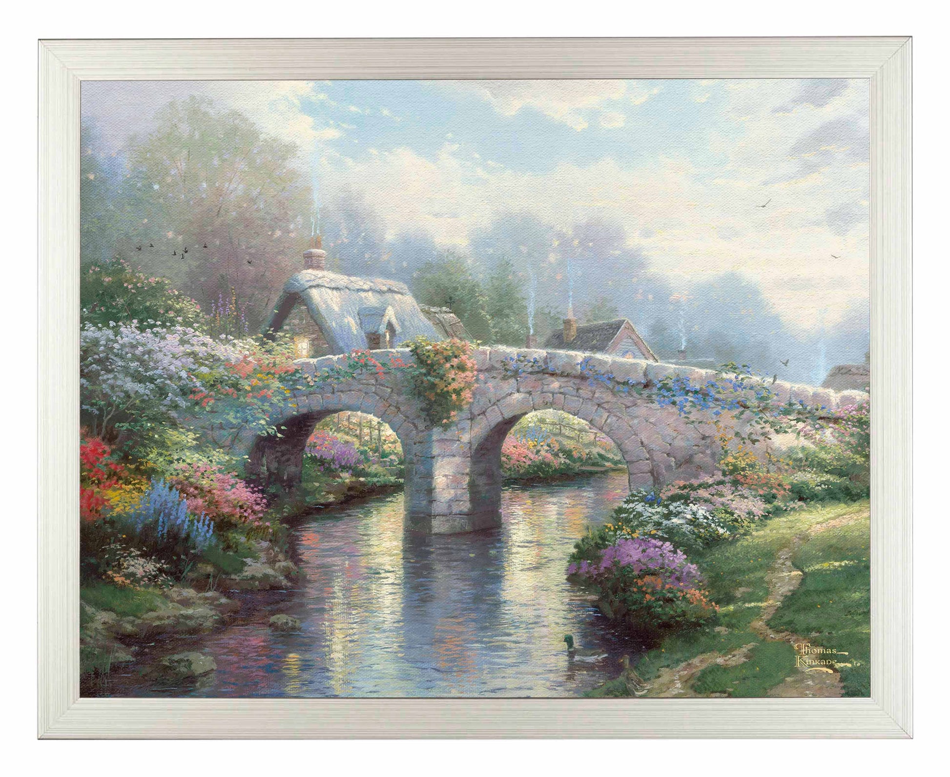 Framed painting of a bridge and trees by the lake