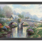 Framed painting of a bridge and trees by the lake