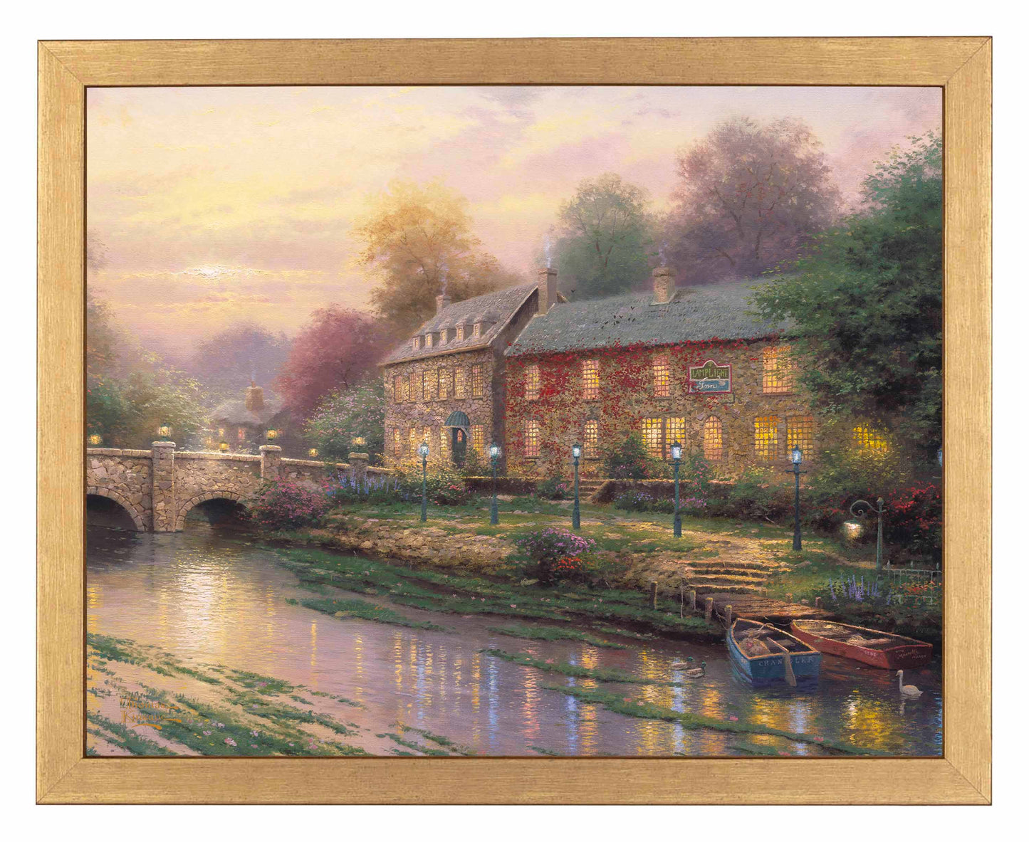 Framed painting of an inn with lamplights and a bridge by the river