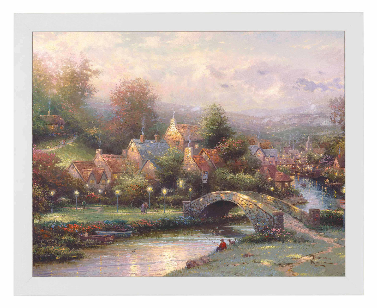 Framed painting of a village with houses, trees and a bridge by the river
