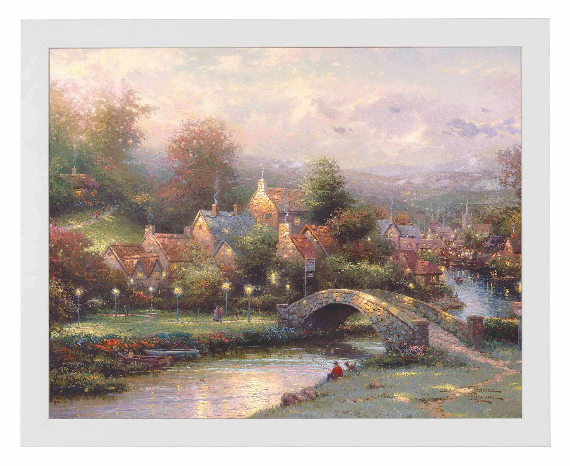 Framed painting of a village with houses, trees and a bridge by the river