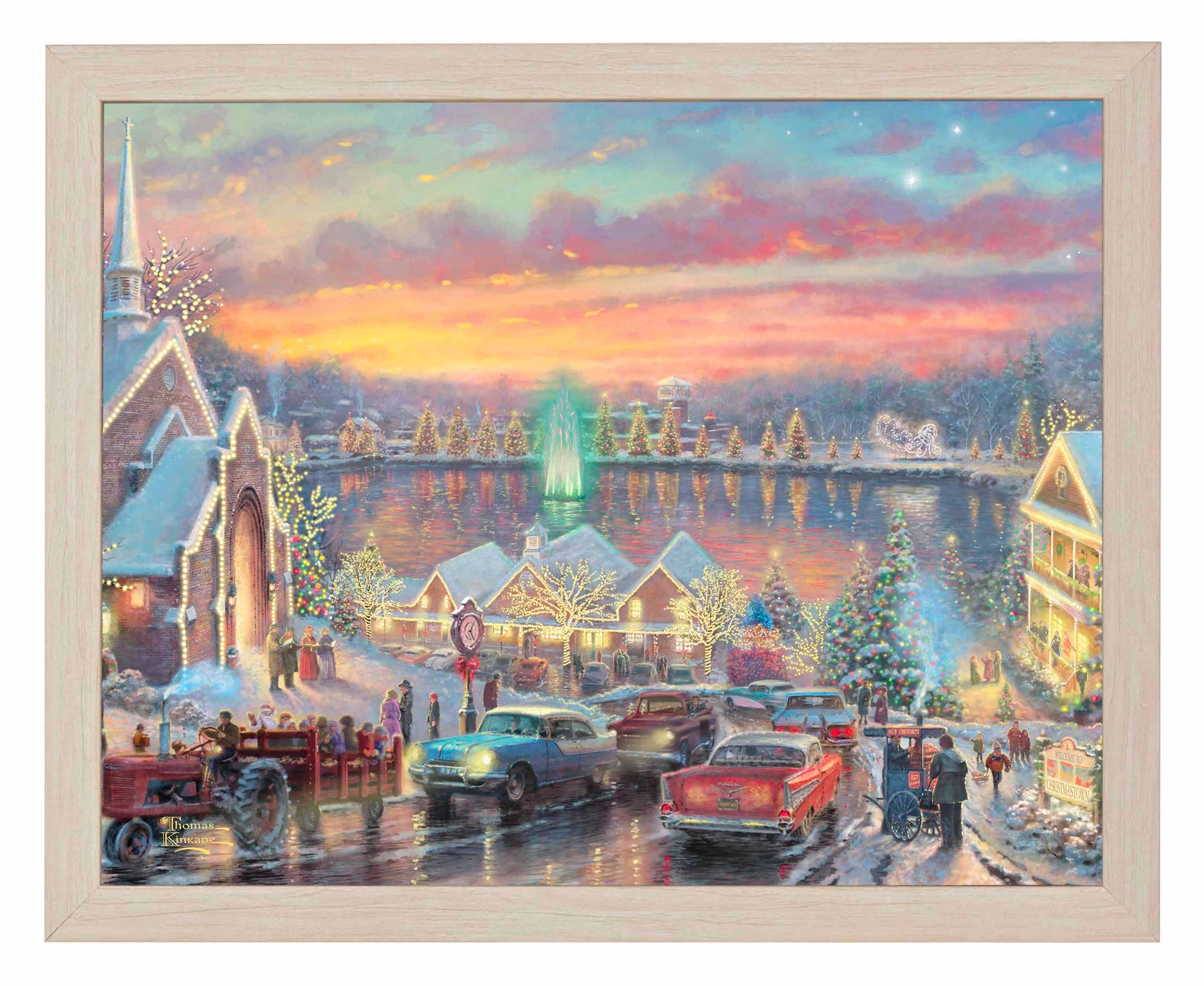 Framed painting of Christmas with vibrant lights of the city with a chapel, houses, people and cars all by the river