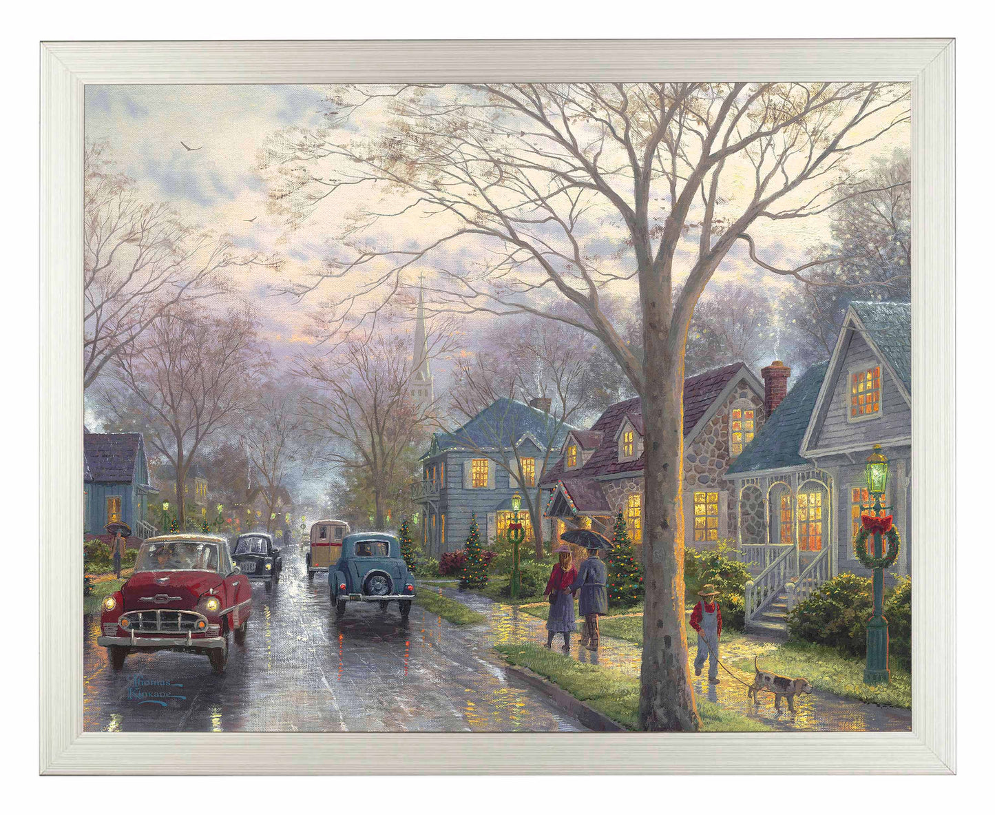 Framed painting of hometown Christmas with houses and cars on the street