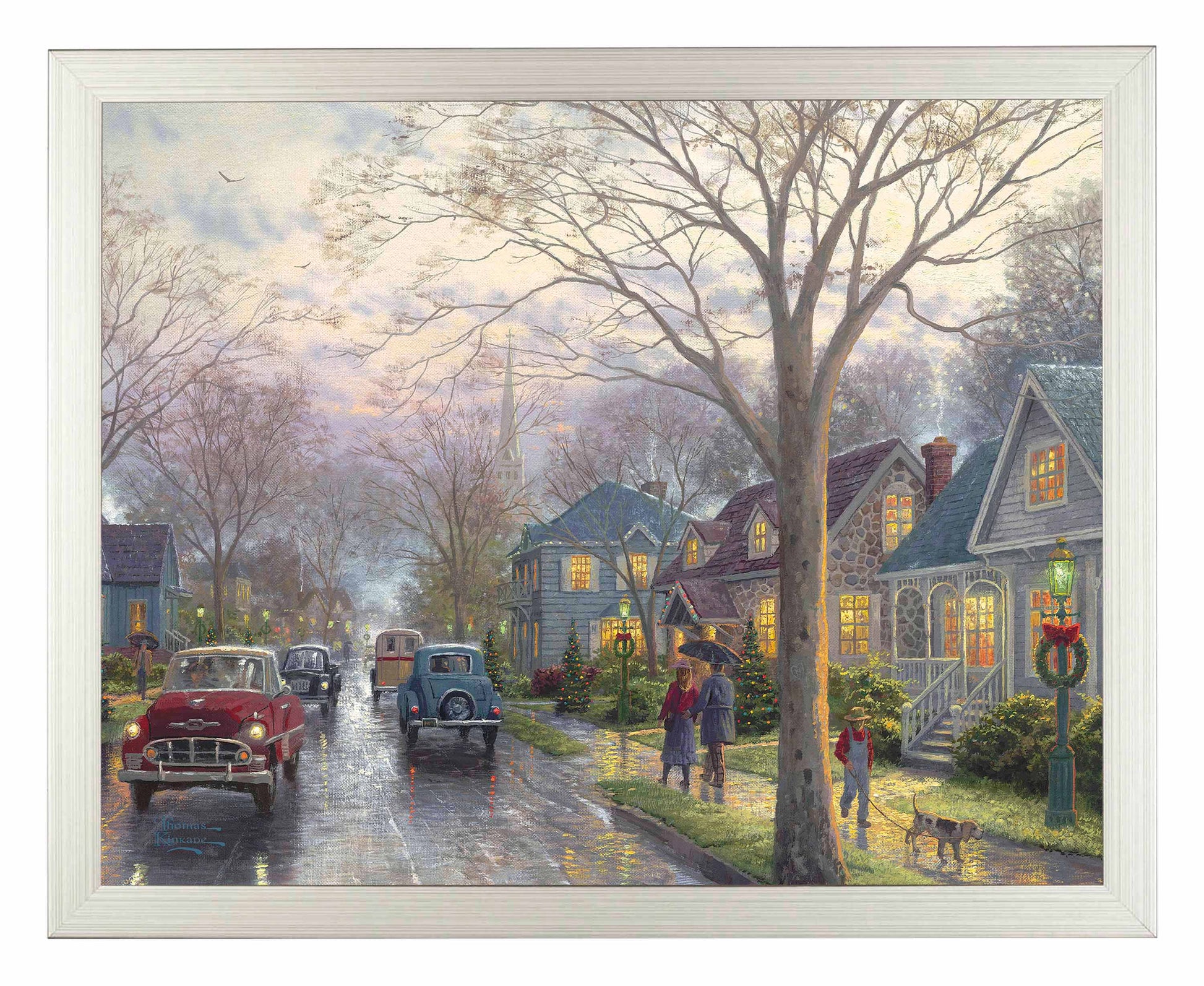Framed painting of hometown Christmas with houses and cars on the street