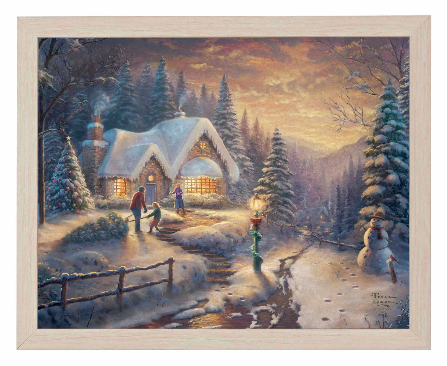 Framed painting of country Christmas cottage with trees and people playing around