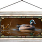 Framed painting of a swimming duck in the river