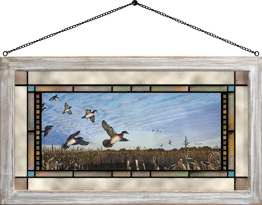 Framed painting with flying birds