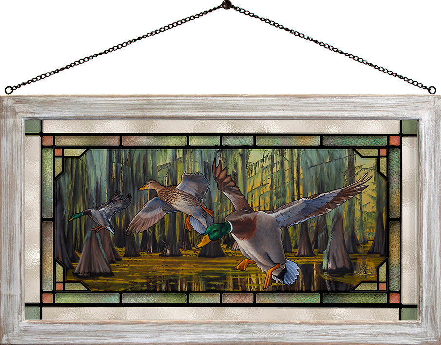 Framed painting of flying birds over the water