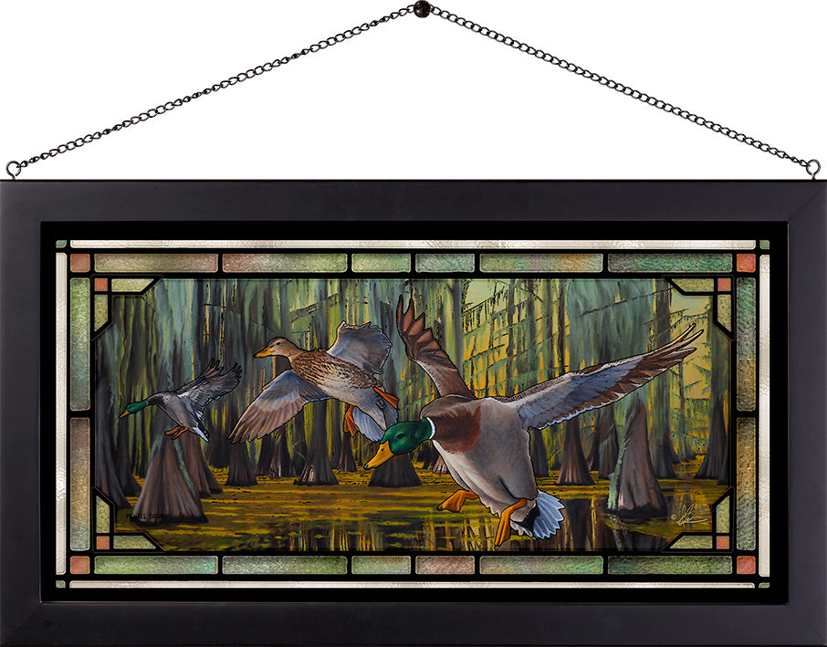 Framed painting of flying birds over the water