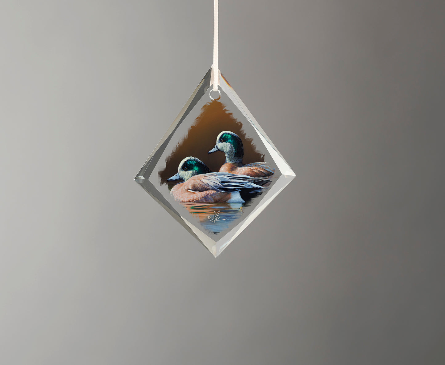 Glass ornament with two ducks in the river