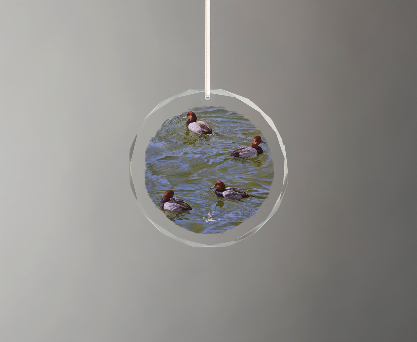 Glass ornament with little swimming ducks
