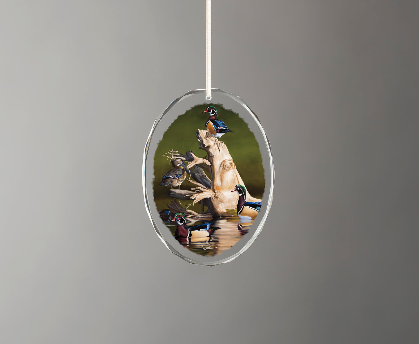 Glass ornament with birds